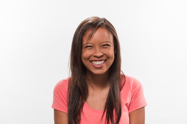 Close-up of a smiling pretty girl against white background