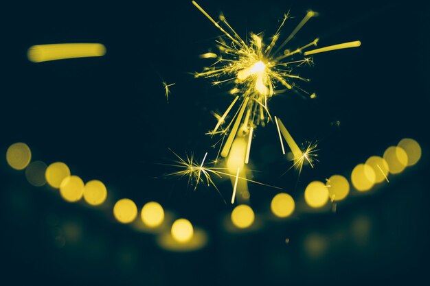 Close-up of sparkler on bokeh background