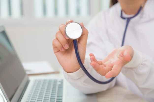 Close-up of specialist using a stethoscope