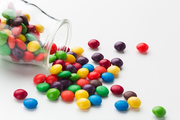 Free photo close-up spilled candy jar