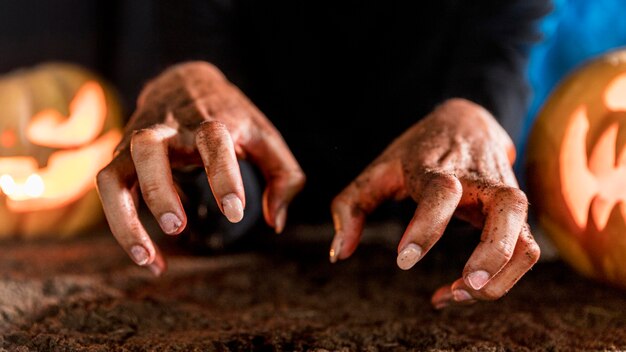 Close-up spooky hands halloween concept