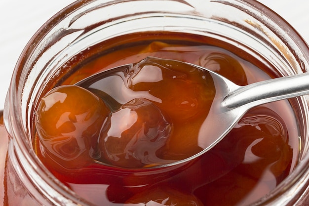 Close-up spoon in jam jar