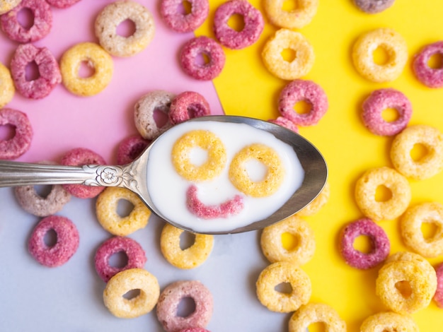 Free photo close-up spoon with cereal smiley face