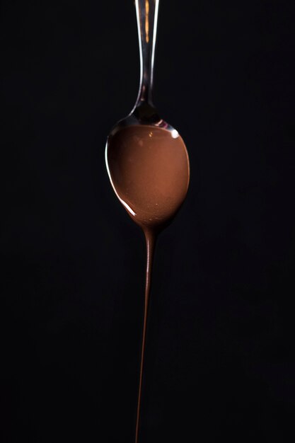Close-up spoon with tasty chocolate mousse