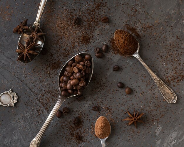 Close-up spoons filled with coffee and spices