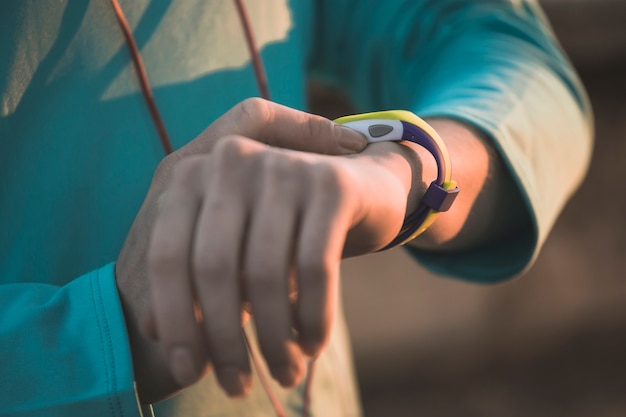 Close-up of sportswoman consulting her watch