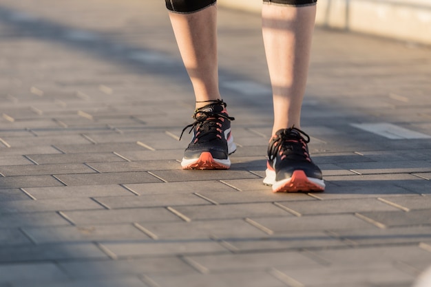 Close-up of sportswoman with sneakers