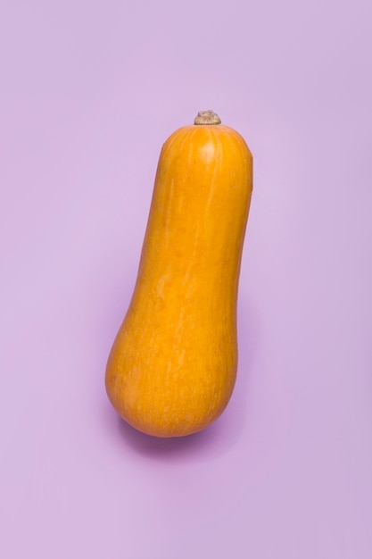 Close-up of a squash on purple surface