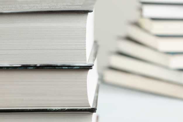 Close-up stacked books with defocused background