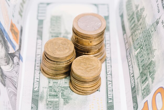 Close-up of stacked coins on banknote