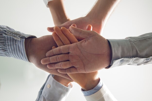 Close-up of stacked hands of business team