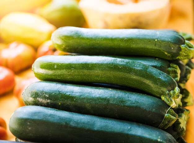 Close-up of staked green farm fresh zucchini for sale