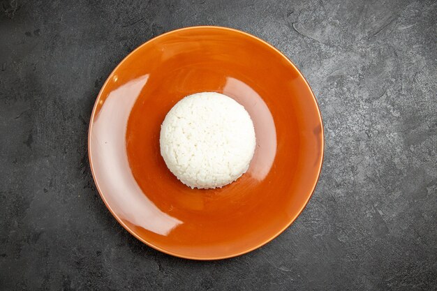 Close up on steamed rice meal on a brown plate