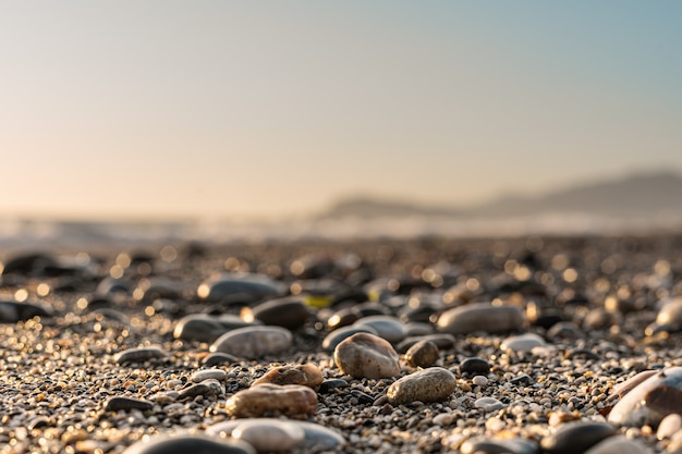 Close up stone background with blurred sky on the horizon