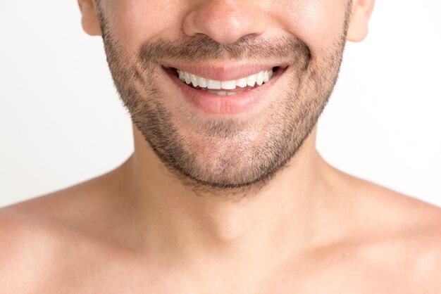 Close-up of stubble young man with toothy smile