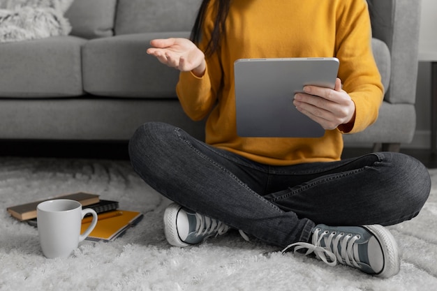 Close up student holding tablet