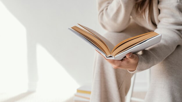 Close up student reading book