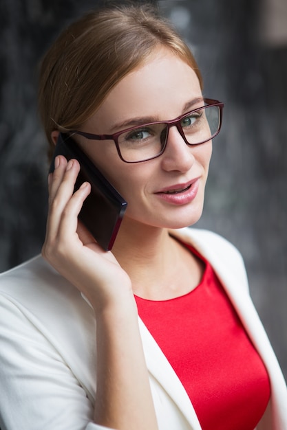 Close up of Stylish Smiling Young Woman Calling