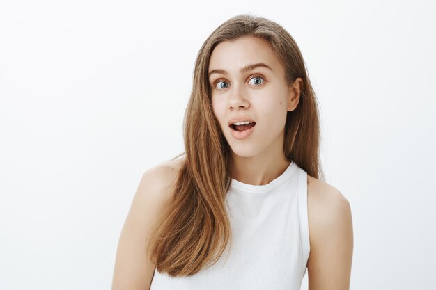 Close-up of surprised girl learn interesting gossip, found out latest news