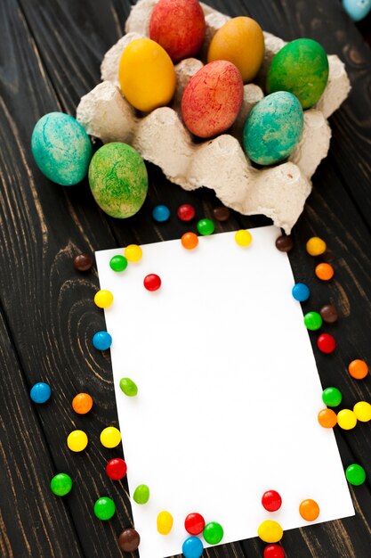 Close-up sweets and eggs near paper