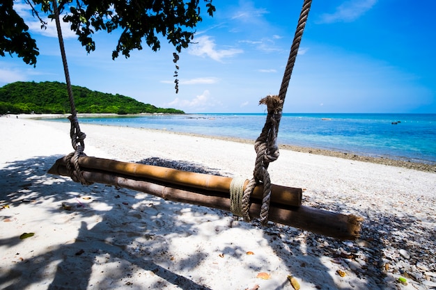 Close-up of a swing on beach