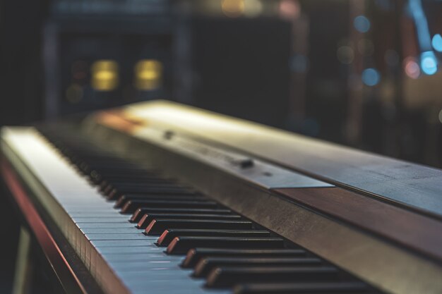 Close up of synthesizer keys with a blurred background.