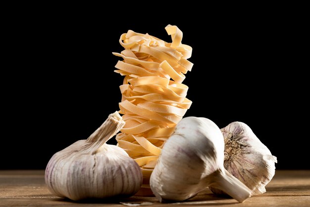 Close-up tagliatelle with garlic on table