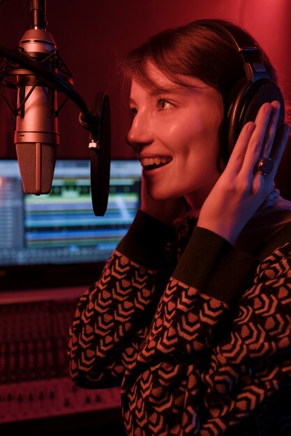 Close up talented woman wearing headphones