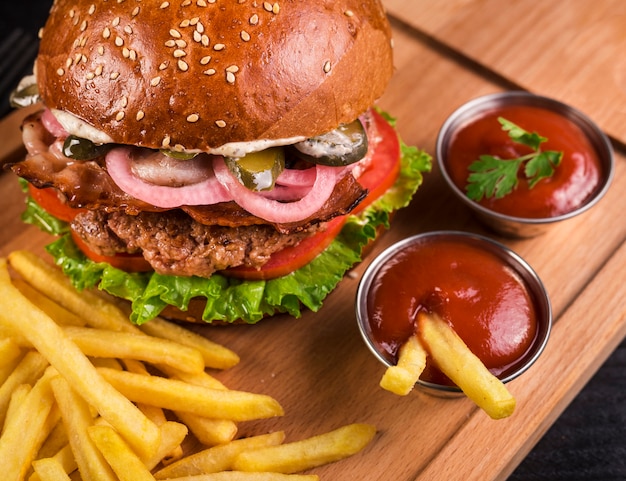 Close-up tasty beef burger with french fries