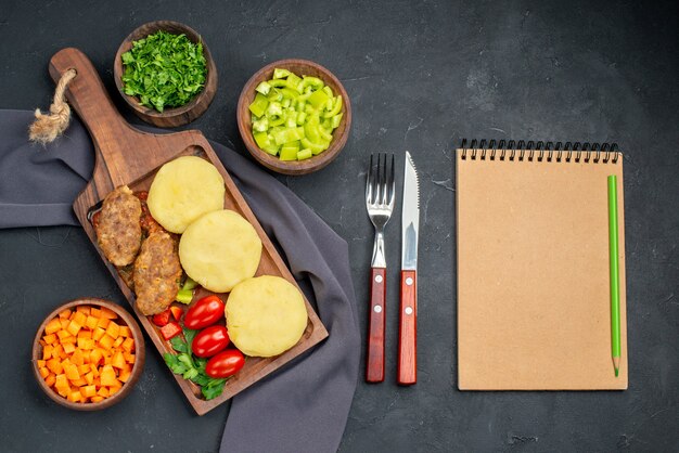 Close up on tasty cutlets chopped vegetables