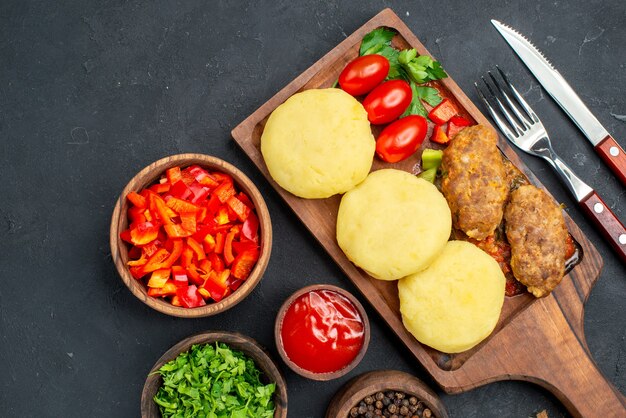 Close up on tasty cutlets chopped vegetables