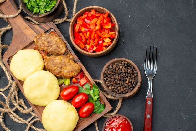 Close up on tasty cutlets chopped vegetables