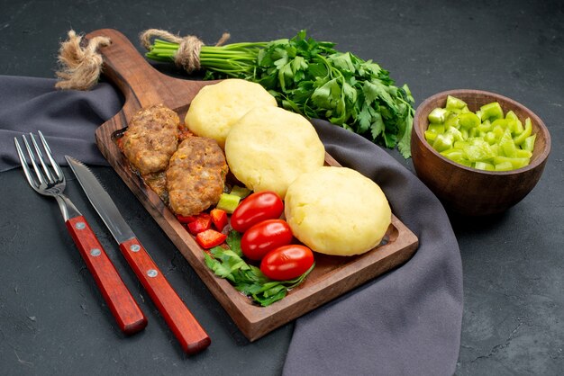 Close up on tasty cutlets chopped vegetables