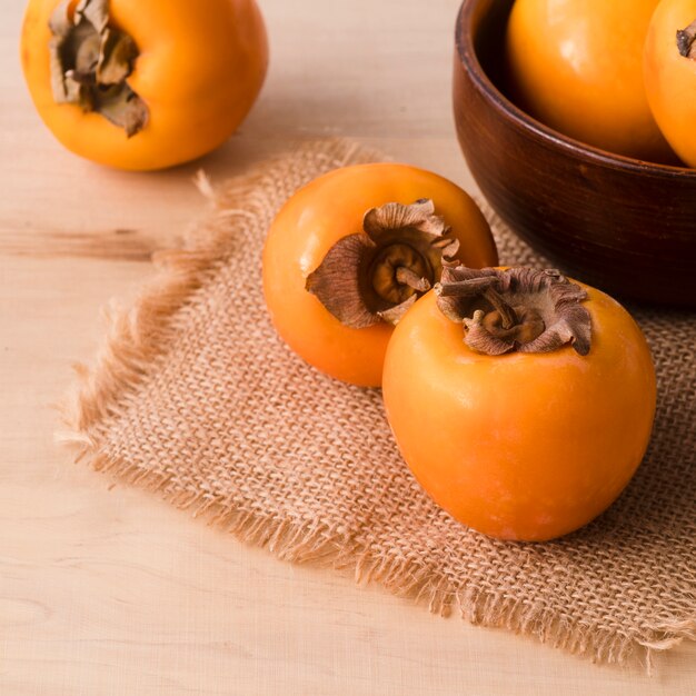 Close-up tasty persimmons on the table