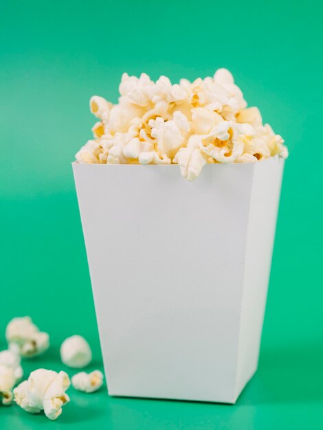 Close-up tasty popcorn box on the table