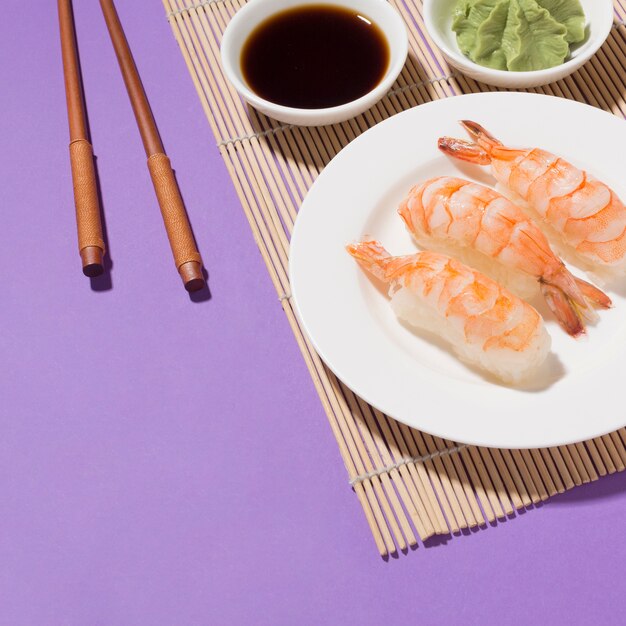 Close-up tasty sushi and soy sauce on the table