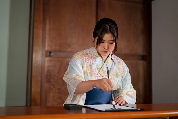 Close up on teacher doing japanese calligraphy, called shodo