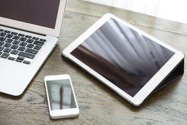 Close-up of technological devices on wooden desk