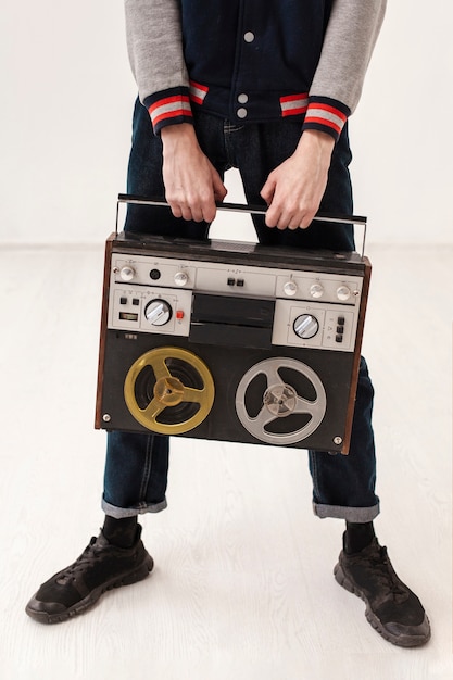 Close-up teenager holding cassette