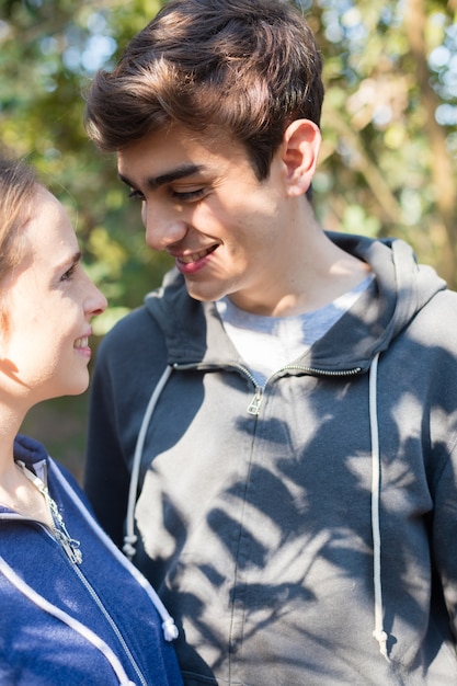 Close-up of teenagers flirting on a sunny day