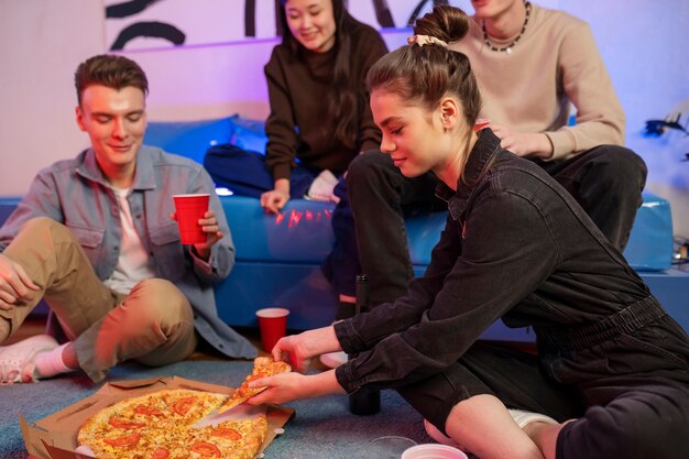 Close up teenagers with delicious pizza