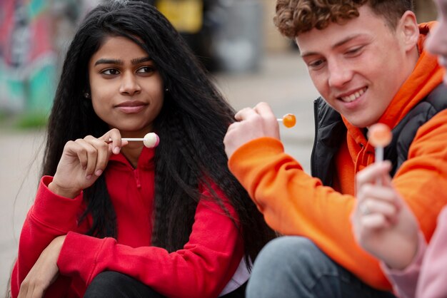 Close up teens with lollipops