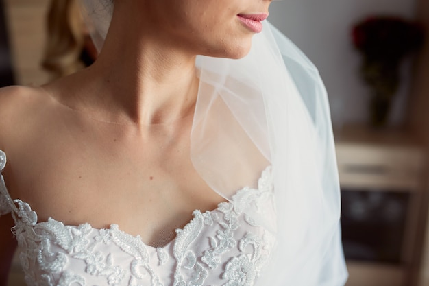 Close-up of tender bride's naked shoulders