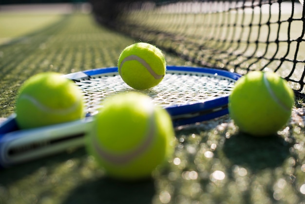 close-up tennis balls on racket