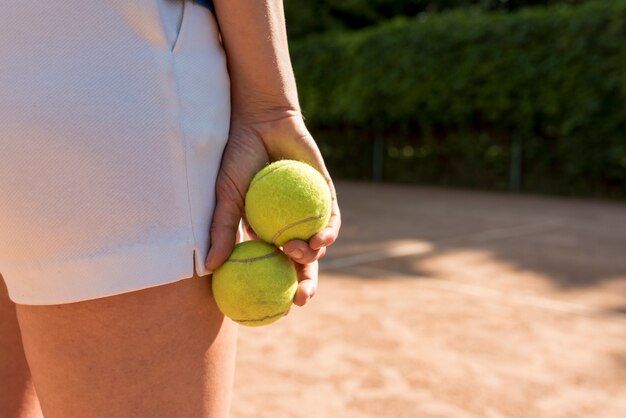 Close-up of tennis player with sport equipment