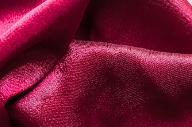 Текстура крупного плана бордовой ткани костюма