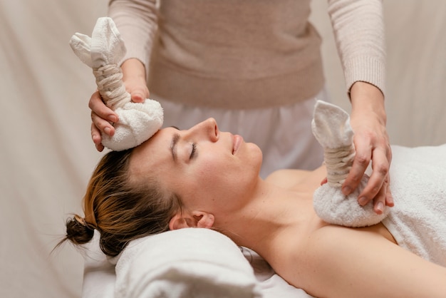 Close up therapist holding wet towels