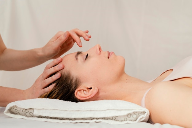 Close up therapist massaging patient's  head
