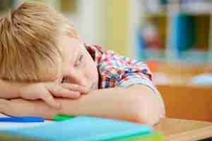 Free photo close-up of tired elementary student