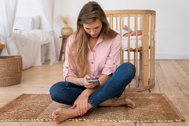 Free photo close up on tired mom taking care of newborn baby